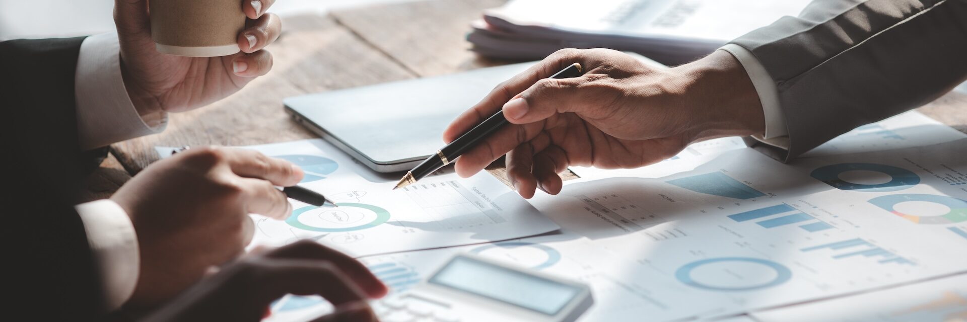 The sales department is having a monthly summary meeting to bring it to the department manager, they are verifying the correctness of the documents that are prepared before bringing in to the manager